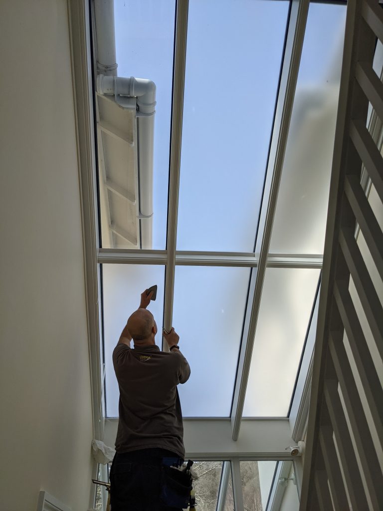 man-cleaning-roof-768x1024